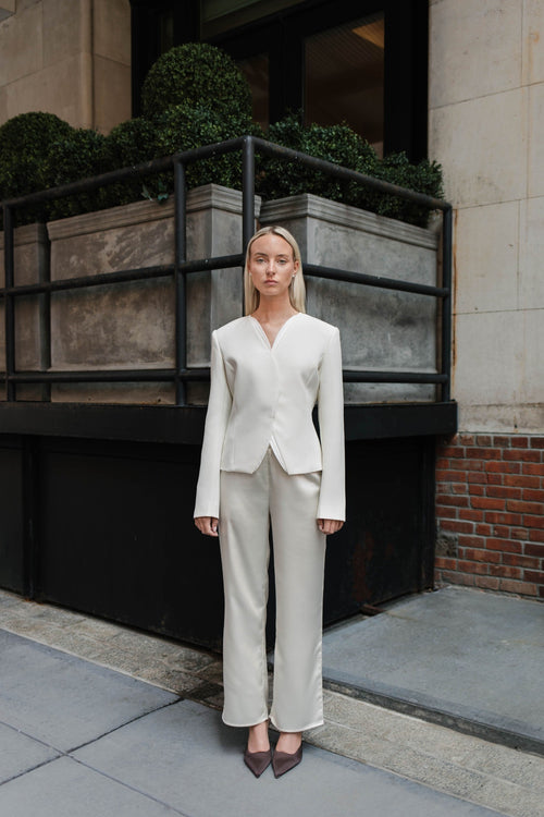 Cream satin straight leg trousers by steph alise with an elastic waistband