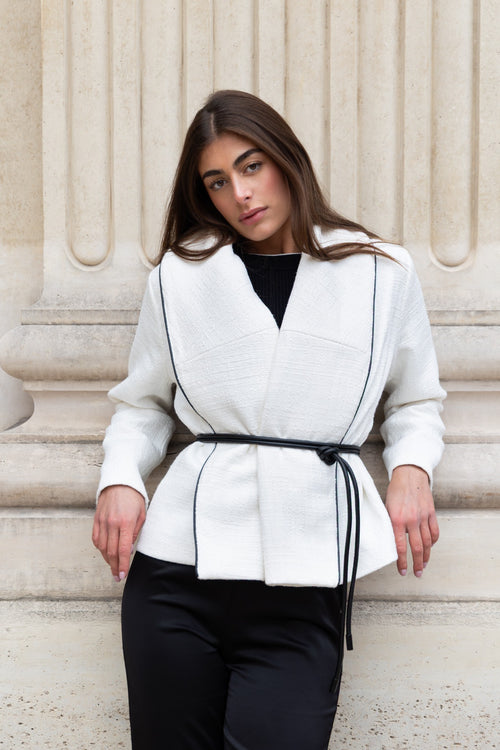 Boucle jacket by steph alise with an oversized lapel and faux leather tie belt